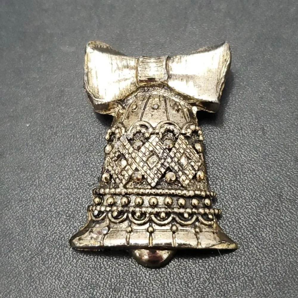 Vintage gold tone bell brooch